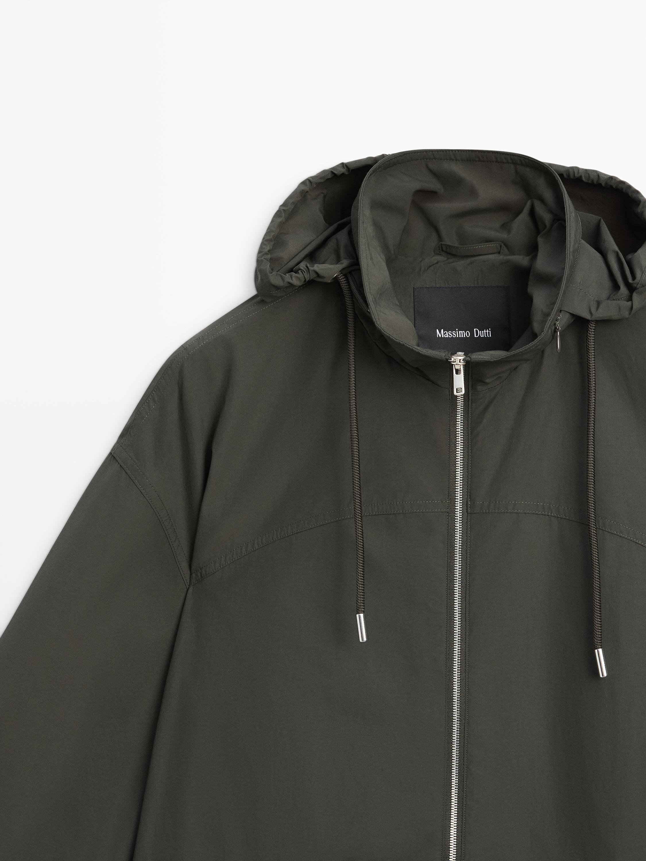 Trench tissu technique à capuche